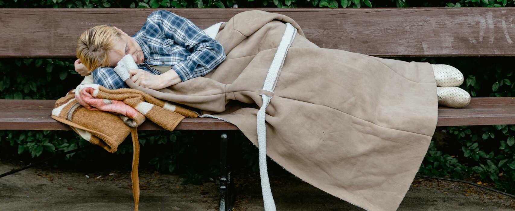 A Woman Sleeping on the Bench